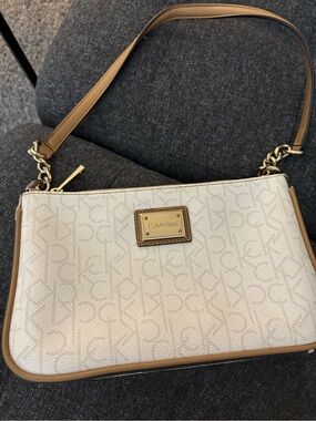 Calvin Klein Cream Monogram demi shoulder bag with Gold-Tone Plaque